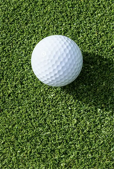 white golf ball on putting green